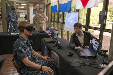 BANGOR, Wash. (April 27, 2017) Sonar Technician 2nd Class Andrew McFarland, assigned to Trident Training Facility (TTF) Bangor, tests the OceanLens, which uses an Oculus Rift virtual reality headset to create a 3D immersive environment for visualizing undersea topography, during the Innovation Lab (iLab) roadshow held at Trident Training Facility Bangor. The iLab, which is located at Naval Submarine Training Center Pacific, in Pearl Harbor, Hawaii, is an initiative launched to spur the rapid development of ideas and concepts to actionable use in submarine warfare. (U.S. Navy photo by Mass Communication Specialist 1st Class Amanda R. Gray/Released)