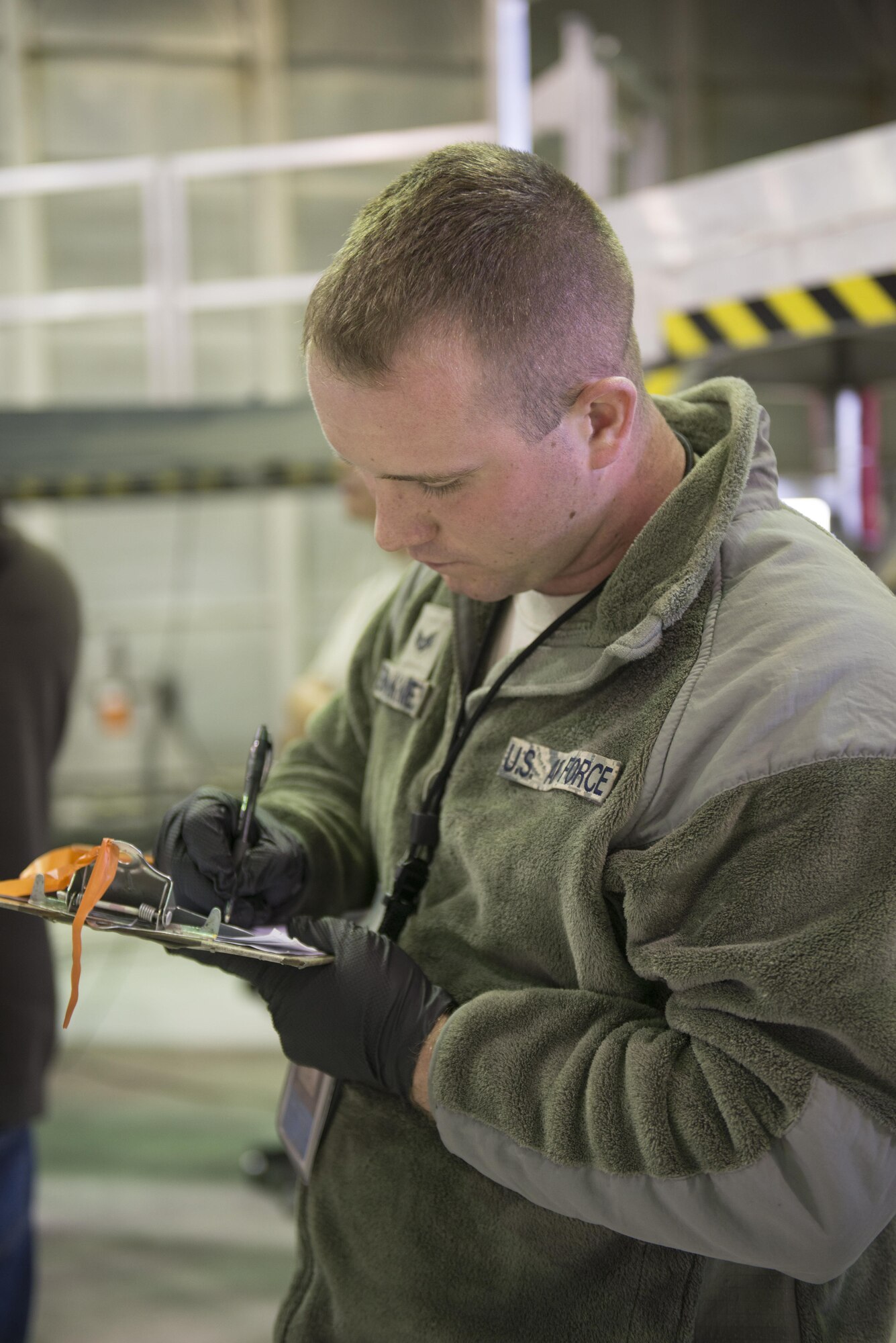 EIELSON AIR FORCE BASE, Alaska – U.S. Air Force Senior Airman Michael “Tater” Brinkmeyer, a 354th Aircraft Maintenance Squadron crew chief, writes evaluations for an F-16 Fighting Falcon from the 18th Aggressor Squadron during NORTHERN EDGE 2017 (NE17), May 2, 2017, at Eielson Air Force Base, Alaska. NE17 is Alaska’s premier joint training exercise designed to practice operations, techniques and procedures as well as enhance interoperability among the services. Thousands of participants from all the services, Airmen, Soldiers, Sailors, Marines and Coast Guardsmen from active duty, Reserve and National Guard units are involved. (U.S. Air Force photo/Staff Sgt. Ashley Nicole Taylor)
