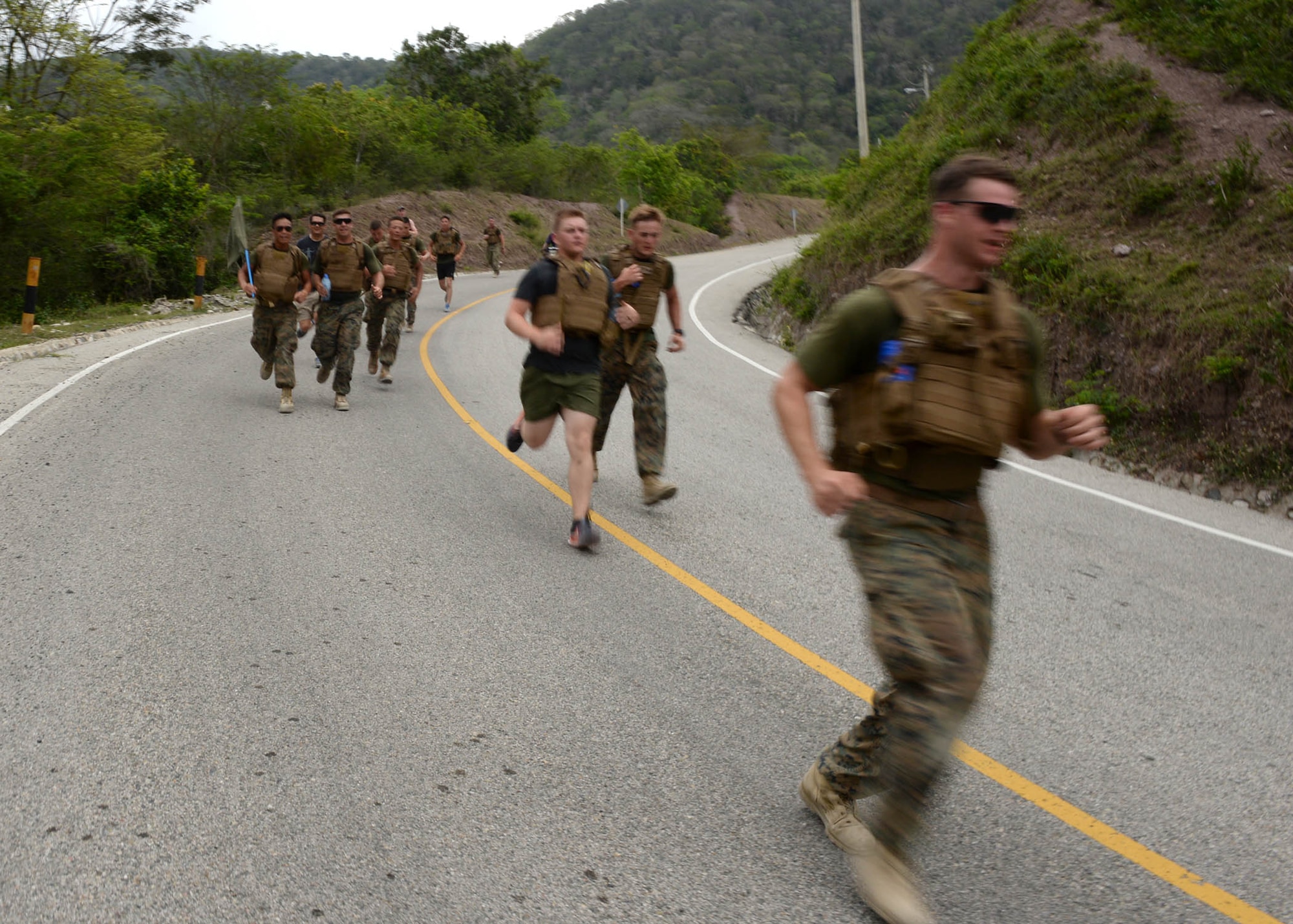 A group of U.S. service members sprint to finish the Sexual Assault Prevention and Response 5K Ruck March in Arroyo Cano, Dominican Republic, April 9, 2017. The Department of Defense’s commitment to the treatment and care of victims of sexual assault began in 2004 with the creation of the Joint Task Force for Sexual Assault Prevention and Response. (U.S. Air Force photo by Staff Sgt. Timothy M. Young)