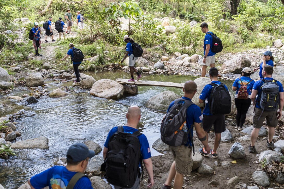 More than 190 members of Joint Task Force-Bravo hiked approximately 3.6 miles round-trip to the village of San Jerónimo, Comayagua, Honduras, Apr. 29, 2017. Members carried more than 5025 lbs of food and supplies, 24 soccer balls and 3 piñatas to the people of San Jerónimo. Chapel hikes have been occurring since 2003, with the JTF-Bravo Chapel sponsoring an average of six every year. The hikes are designed to provide a practical way for JTF-Bravo members to engage and partner with local communities to provide support to surrounding villages in need of food and supplies. (U.S. Air National Guard photo by Master Sgt. Scott Thompson/released)