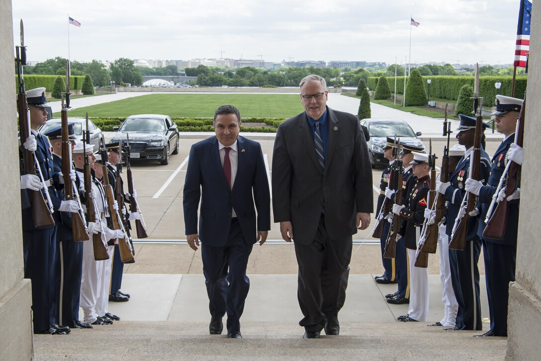 Deputy Defense Secretary Bob Work walks with Tunisian Defense Minister Farhat Horchani before a meeting at the Pentagon, May 2, 2017. DoD photo by Air Force Tech. Sgt. Brigitte N. Brantley