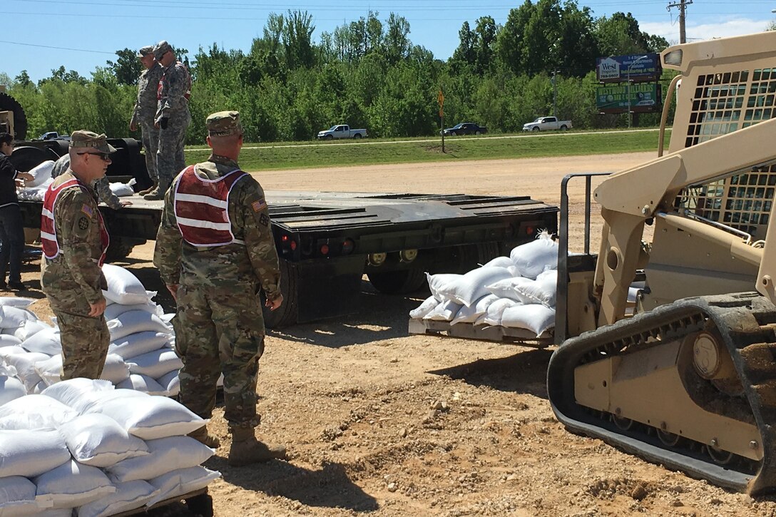 Missouri National Guardsmen and JROTC members fill sandbags to help with flooding relief in Poplar Bluff, Mo., May 2, 2017. The guardsmen are assigned to the 1138th Engineer Company, Farmington Mo., and the 294th Engineer Company.  Air National Guard photo by Senior Master Sgt. Mary-Dale Amison