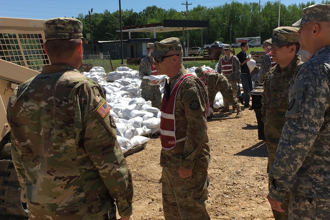 Missouri National Guardsmen and JROTC members fill sandbags to help with flooding relief in Poplar Bluff, Mo., May 2, 2017. The guardsmen are assigned to the 1138th Engineer Company, Farmington Mo., and the 294th Engineer Company.  Air National Guard photo by Senior Master Sgt. Mary-Dale Amison
