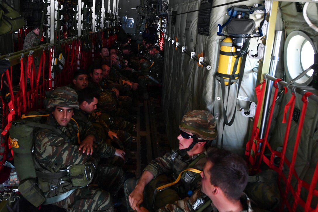 Greek paratroopers sit inside a U.S. Air Force C-130J Super Hercules during Exercise Stolen Cerberus IV at Elefsis Air Base, Greece, April 26, 2017. About 40 paratroopers performed static-line and military free-fall jumps from the aircraft as part of the training. Air Force photo by Senior Airman Tryphena Mayhugh