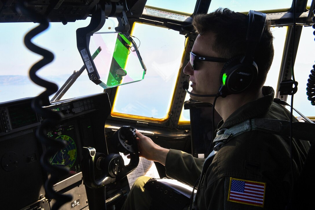 Air Force 1st Lt. Nicholas Gibson flies a C-130J Super Hercules during Exercise Stolen Cerberus IV at Elefsis Air Base, Greece, April 26, 2017. Air Force pilots assigned to the 37th Airlift Squadron trained in low-level flying during the exercise. Air Force photo by Senior Airman Tryphena Mayhugh