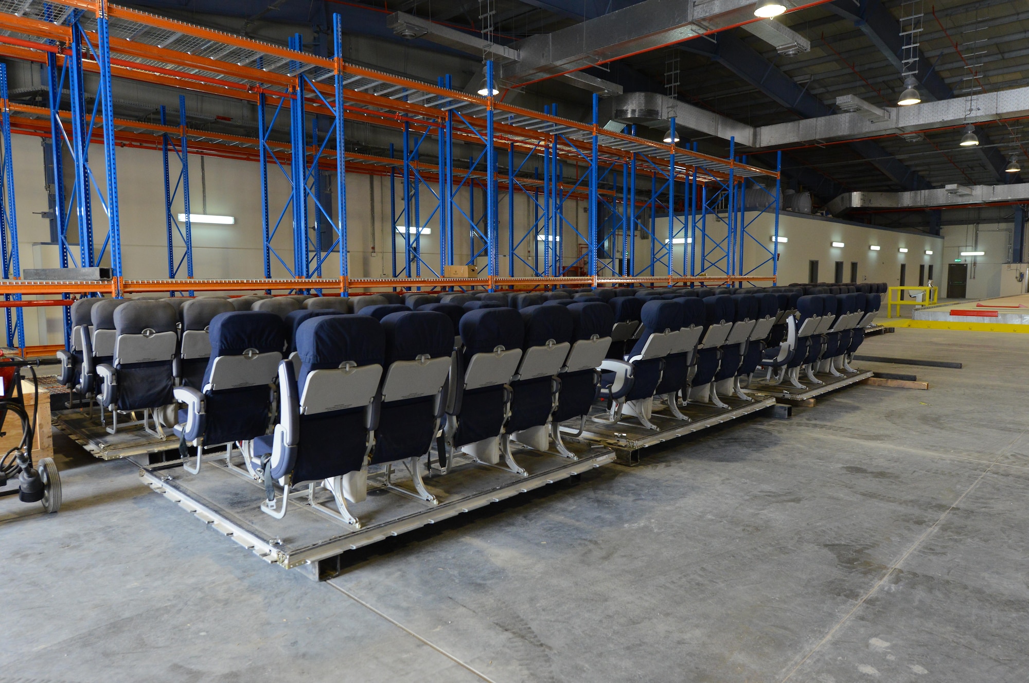 Seat kits, consisting of portable aircraft seats used inside transportation aircraft, are stored inside a Qatari facility recently constructed on Al Udeid Air Base, Qatar, on April 26, 2017. The new facility, used jointly by the U.S. and Qatari air forces, provides the proper environment, previously unavailable on Al Udeid Air Base, to store the kits.(U.S. Air Force photo by Tech. Sgt. Bradly A. Schneider)