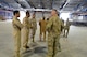 Qatari officials greet U.S. Air Force Lieutenant Colonel Robert Magee, squadron commander for the 8th Expeditionary Air Mobility Squadron (facing away from the camera), inside a newly constructed Qatari facility located at Al Udeid Air Base, Qatar, April 26, 2017. The Qatari officials and Macgee met inside the facility to observe a training exercise kicking off collaboration between the Qatari Air Force and the U.S. air force. (U.S. Air Force photo by Tech. Sgt. Bradly A. Schneider)