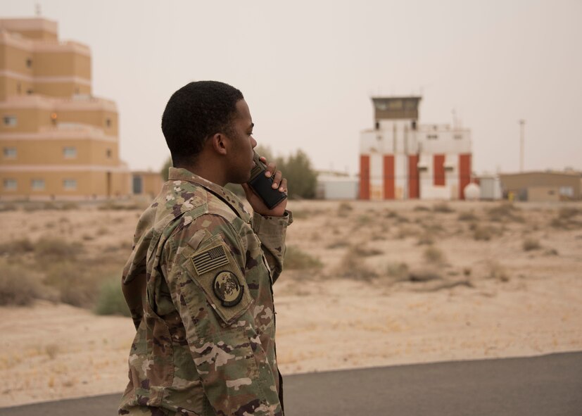 Senior Airman Jourdan Chaney, an airfield management specialist with the 386th Expeditionary Operations Support Squadron, communicates with air traffic controllers via radio at an undisclosed location in Southwest Asia, April 30, 2017. Airfield management specialists are the airfield operations eyes on the ground for the air traffic controllers in the tower. (U.S. Air Force photo/Tech. Sgt. Jonathan Hehnly)  