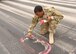 Senior Airman Jourdan Chaney, an airfield management specialist with the 386th Expeditionary Operations Support Squadron, identifies safety hazards on the runway at an undisclosed location in Southwest Asia, April 30, 2017. Airfield management specialists manage airfield operations to ensure a safe, effective, and efficient airfield environment. (U.S. Air Force photo/Tech. Sgt. Jonathan Hehnly)  