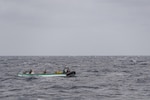 CARIBBEAN SEA (April 19, 2017) - U.S. Coast Guard Law Enforcement (LEDET) personnel embarked on the Cyclone-class patrol coastal ship USS Zephyr (PC 8) board a panga carrying 750 kilograms of cocaine. Zephyr is currently underway in support of Operation Martillo, a joint operation with the U.S. Coast Guard and partner nations, within the U.S. 4th Fleet area of operations. (U.S. Navy photo by Mass Communication Specialist 3rd Class Casey J. Hopkins/Released)