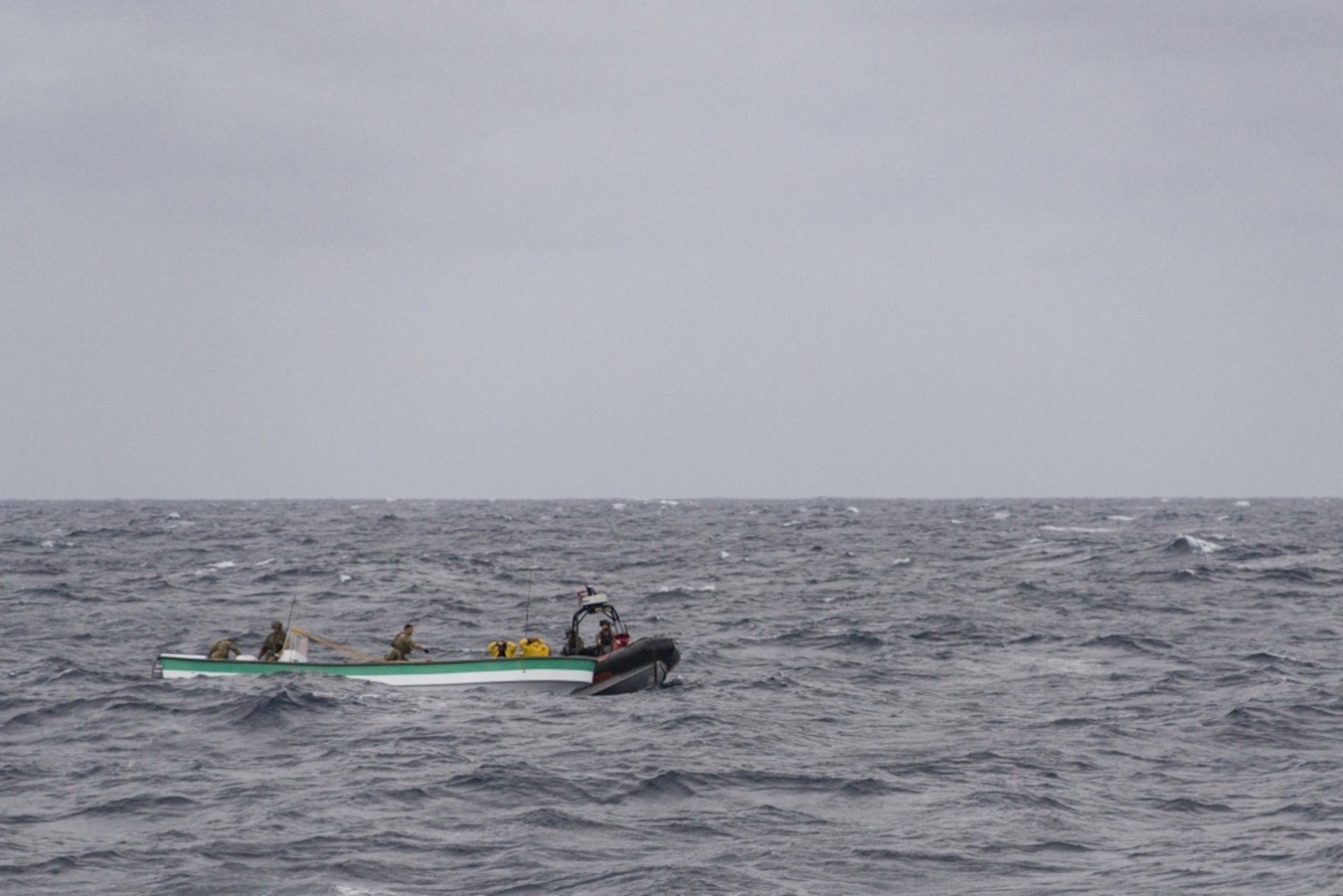 CARIBBEAN SEA (April 19, 2017) - U.S. Coast Guard Law Enforcement (LEDET) personnel embarked on the Cyclone-class patrol coastal ship USS Zephyr (PC 8) board a panga carrying 750 kilograms of cocaine. Zephyr is currently underway in support of Operation Martillo, a joint operation with the U.S. Coast Guard and partner nations, within the U.S. 4th Fleet area of operations. (U.S. Navy photo by Mass Communication Specialist 3rd Class Casey J. Hopkins/Released)