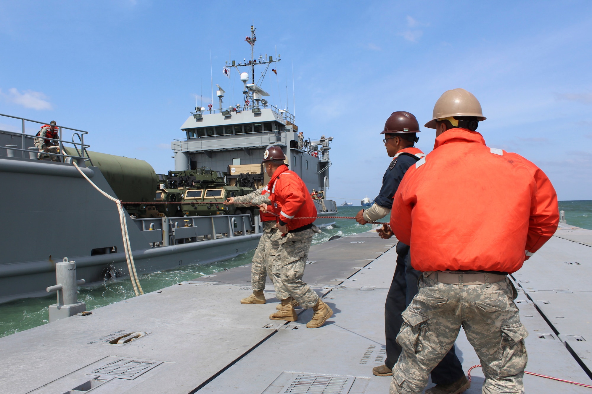 Members of the 7th Transportation Brigade (Expeditionary), 11th Transportation Battalion, 331st Causeway Company, tie mooring lines from a Landing Craft Utility during the Combined Joint Logistics Over-the-Shore 2017 exercise in Pohang, South Korea, April 19, 2017. CJLOTS is the process of loading and offloading ships in austere areas where ports are damaged, unavailable or lack adequate fixed-port facilities. (U.S. Army photo/Capt. Derrick Dixon) 