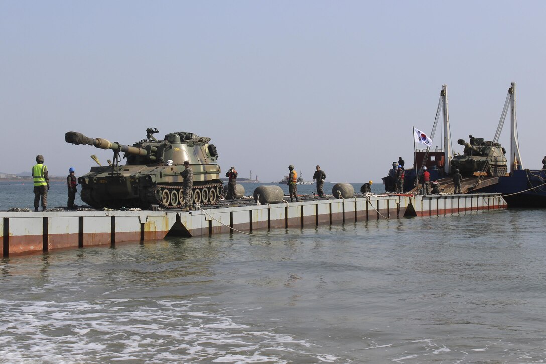 Republic of Korea military members offload equipment using the ROK military’s pier during the Combined Joint Logistics Over-the-Shore 2017 exercise in Pohang, South Korea, April 13, 2017. The ROK pier is similar to the Army’s Trident pier, also consists of modular causeway pieces, it too is “stabbed” like the U.S. Trident pier, and is used to offload warfighting equipment. (U.S. Army photo/Capt. Derrick Dixon) 