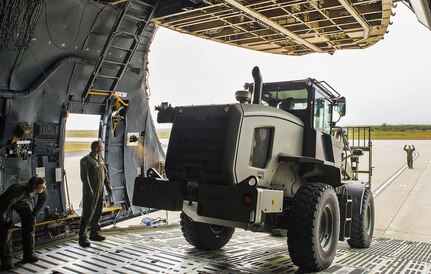 Airmen from the 433rd Airlift Wing unload a 10K all-terrain vehicle from a C-5M Super Galaxy aircraft during exercise Patriot Hook April 26, 2017 at Vandenberg Air Force Base, California. Patriot Hook is an annual joint-service exercise coordinated by the Air Force Reserve, designed to integrate the military and first responders of federal, state and local agencies by providing training to mobilize quickly and deploying in military aircraft in the event of a regional emergency or natural disaster. (U.S. Air Force photo by Benjamin Faske)