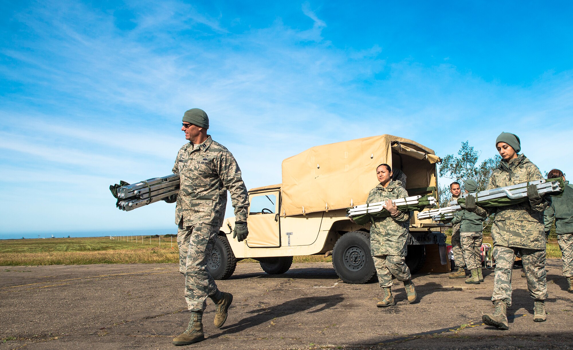 Airmen with the 433rd Medical Squadron haul litters from a Humvee in perperation for patients during exercise Patriot Hook April 27, 2017 at Vandenberg Air Force Base, California. Patriot Hook is an annual joint-service exercise coordinated by the Air Force Reserve, designed to integrate the military and first responders of federal, state and local agencies by providing training to mobilize quickly and deploy in military aircraft in the event of a regional emergency or natural disaster. (U.S. Air Force photo by Benjamin Faske)