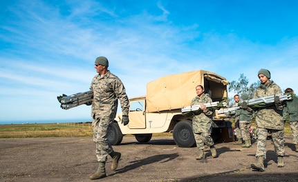 Airmen with the 433rd Medical Squadron haul litters from a Humvee in perperation for patients during exercise Patriot Hook April 27, 2017 at Vandenberg Air Force Base, California. Patriot Hook is an annual joint-service exercise coordinated by the Air Force Reserve, designed to integrate the military and first responders of federal, state and local agencies by providing training to mobilize quickly and deploy in military aircraft in the event of a regional emergency or natural disaster. (U.S. Air Force photo by Benjamin Faske)