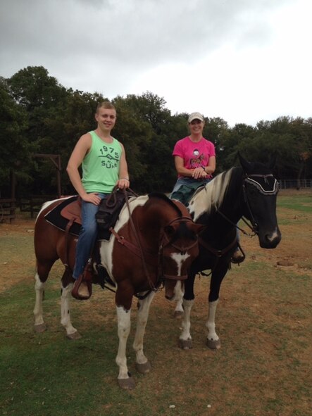 Michael Drinkwater sits on the back of a horse next to his mother in Texas. At 12 years old, Drinkwater and his family moved to Texas, where he lived until he joined the Air Force. (Courtesy Photo)