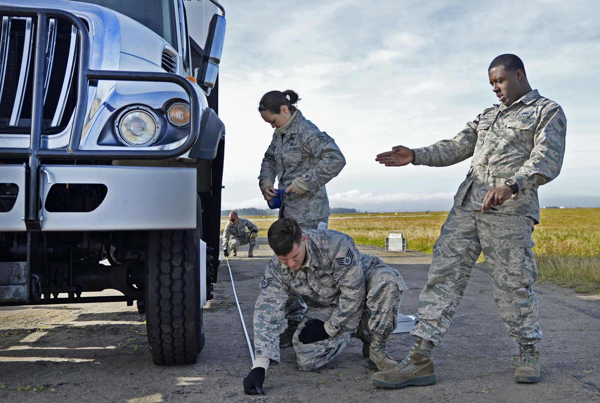 Staff Sgt. John Shue, Senior Airman Antonio Settle, and Senior Airman Audree Curry, 26th Aerial Port Squadron air transportation technicians, measure and weigh a vehicle before loading onto a C-5M Super Galaxy Aircraft during exercise Patriot Hook April 27, 2017 at Vandenberg Air Force Base.  Patriot Hook is an annual joint-service exercise coordinated by the Air Force Reserve, designed to integrate the military and first responders of federal, state and local agencies by providing training to mobilize quickly and deploying in military aircraft in the event of a regional emergency or natural disaster.  (U.S. Air Force photo by Benjamin Faske