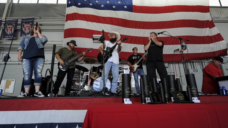 Rewired, a local band from Pensacola, Fla., performs a music set prior to the Alpha Warrior battle rig competition at the Commando Hangar on Hurlburt Field, Fla., April 29, 2017. The event offered live music, free food and friendly competition. (U.S. Air Force photo by Airman 1st Class Dennis Spain)