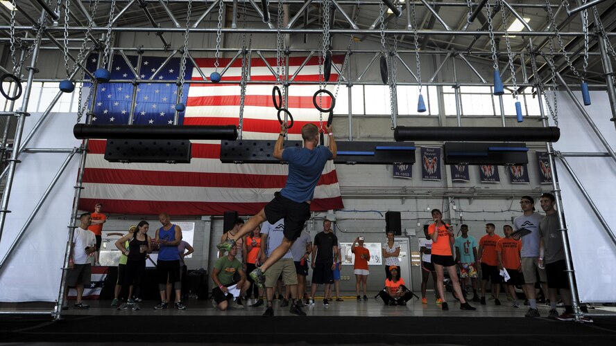Team Hurlburt and families participate in the Alpha Warrior Battle Rig competition at the Commando Hangar on Hurlburt Field, Fla., April 29, 2017. Alpha Warrior is an obstacle competition similiar to that of television competition show American Ninja Warrior. The Alpha Warrior competition travels throughout the U.S. to offer service members the opportunity to maneuver the battle rig’s obstacles.  (U.S Air Force photo by Airman 1st Class Dennis Spain)