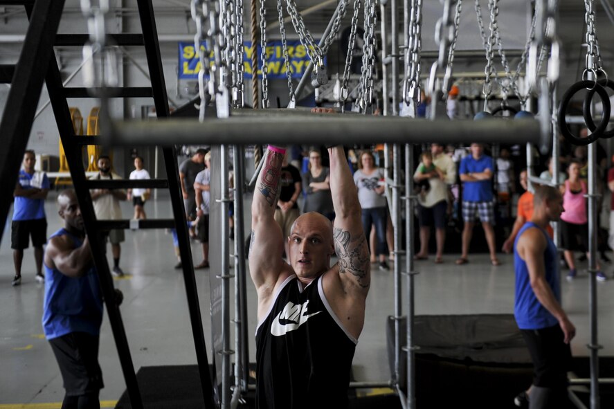Bo Flume, a participant in the Alpha Warrior battle rig competition, focuses on his next maneuver at Hurlburt Field, Fla., April 29, 2017. Flume was one of many to participate in the event which challenged grip-strength, agility and core strength. (U.S. Air Force photo by Airman 1st Class Dennis Spain)