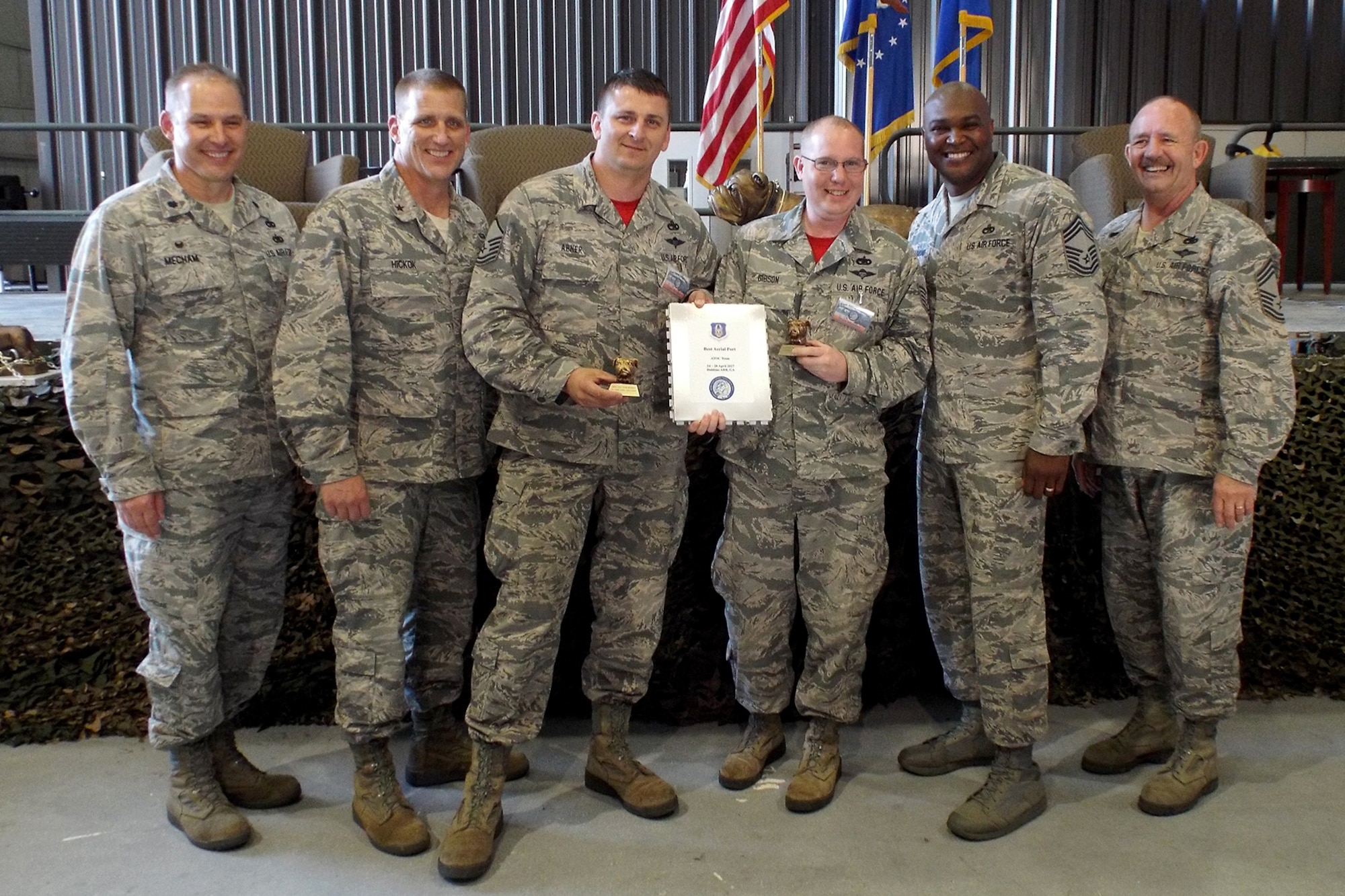 (Left to Right) U.S. Air Force Reserve Lt. Col. Keith Mecham, commander, 67th Aerial Port Squadron, Brig. Gen. John A. Hickok, deputy director of logistics, engineering and force protection, Headquarters Air Force Reserve Command, Master Sgt. Morgan Abner, 96th Aerial Port Squadron, Tech Sgt. Jason Gibson, 96th APS, Chief Master Sgt. Darius Drummond, air transportation career field manager, Headquarters Air Force, and Chief Master Sgt. Richard Hiney, Port Dawg Challenge Chief, and superintendent, 27th Aerial Port Squadron, pose for a photo after receiving the award for “Best ATOC Mission Load Report Team” during the 2017 Air Force Reserve Command Port Dawg Challenge awards ceremony April 27, 2017, at Dobbins Air Reserve Base, Ga. Twenty-three teams competed in 12 events over three days to prove their air transportation skills. (U.S. Air Force photo by Tech. Sgt. Debra Gentry/Released)