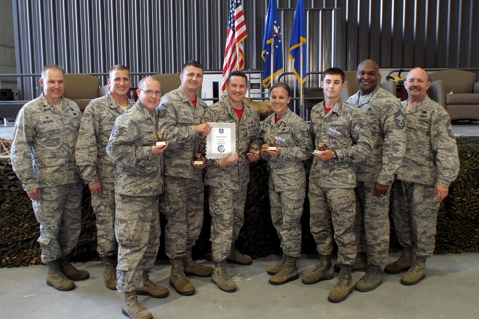(Left to Right) U.S. Air Force Reserve Lt. Col. Keith Mecham, commander, 67th Aerial Port Squadron, Brig. Gen. John A. Hickok, deputy director of logistics, engineering and force protection, Headquarters Air Force Reserve Command, Tech Sgt. Jason Gibson, 96th Aerial Port Squadron, Master Sgt. Morgan Abner, 96th APS, Tech Sgt. Danny Canup, 96th APS, Tech Sgt. Kristen Garrett, 96th APS , Senior Airman Jacob Carter, 96th APS, Chief Master Sgt. Darius Drummond, air transportation career field manager, Headquarters Air Force, and Chief Master Sgt. Richard Hiney, Port Dawg Challenge Chief, and superintendent, 27th Aerial Port Squadron, pose for a photo after receiving the award for “Best Engine Running Onload/Offload (ERO) Team” during the 2017 Air Force Reserve Command Port Dawg Challenge awards ceremony April 27, 2017, at Dobbins Air Reserve Base, Ga. Twenty-three teams competed in 12 events over three days to prove their air transportation skills. (U.S. Air Force photo by Tech. Sgt. Debra Gentry/Released)