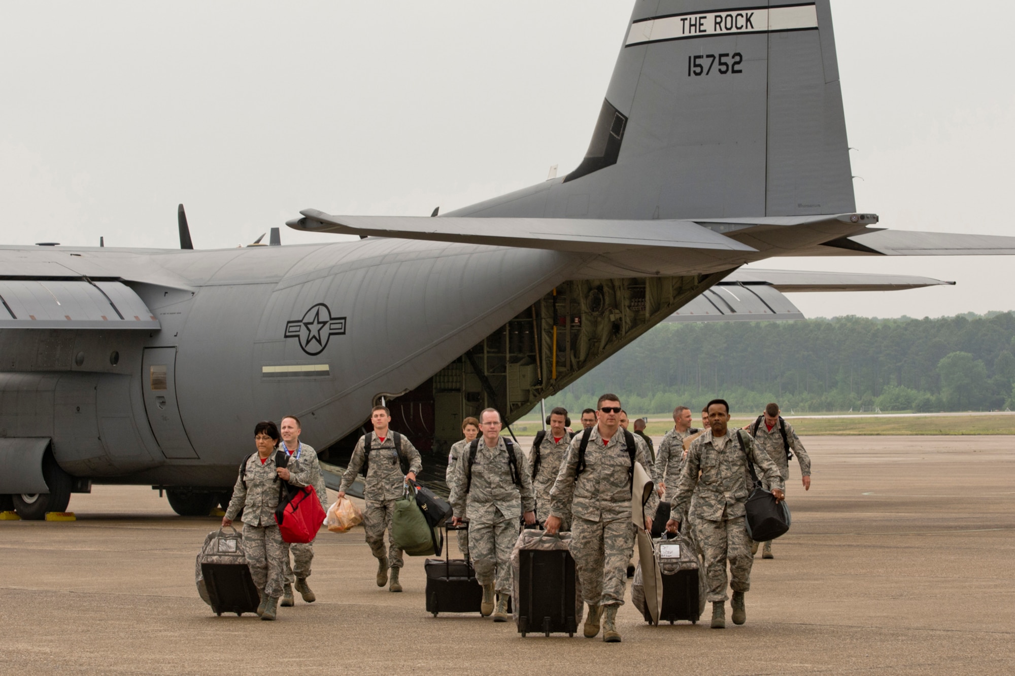Members of the 96th Aerial Port Squadron deplane upon arrival at Little Rock Air Force, Ark., April 28, 2017. The Airman returned to Little Rock victorious, after winning the 2017 Air Force Reserve Command Port Dawg Challenge at Dobbins Air Reserve Base, Ga. The three day competition pitted 23 teams against each other in 12 different events, which were designed to foster communication, leadership, professionalism and camaraderie between the participants. (U.S. Air Force photo by Master Sgt. Jeff Walston/Released)