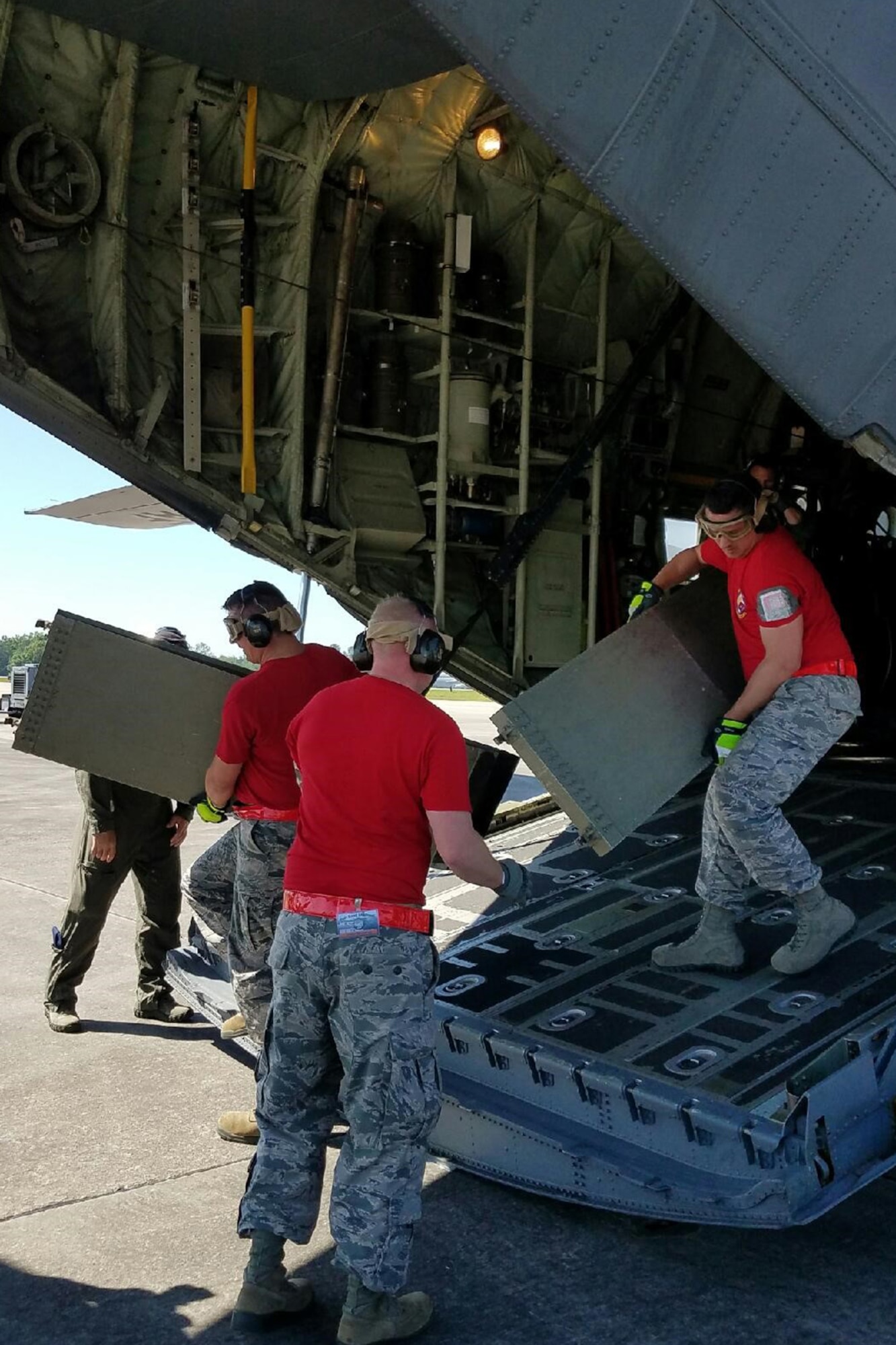 U.S. Air Force Reserve Airmen from the 96th Aerial Port Squadron, reconfigure a C-130J Super Hercules to load a Humvee for an Engines Running On-Load/Odd-Load (ERO) event during the 2017 Air Force Reserve Command Port Dawg Challenge April 26, 2017, at Dobbins Air Reserve Base, Ga.  The three day competition pitted 23 aerial port teams against each other in 12 different events, which were designed to foster communication, leadership, professionalism and camaraderie between the participants. (U.S. Air Force photo by Chief Master Sgt. Cynthia Underwood/Released)