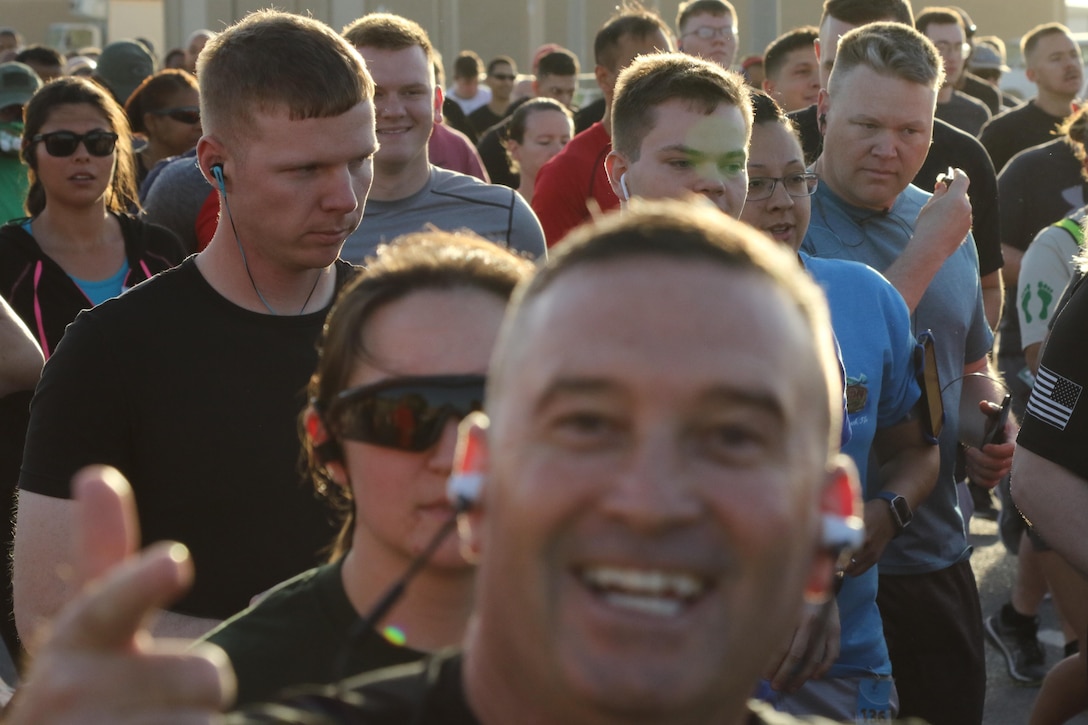 U.S. Servicemembers race off the starting block of the Army Reserve 5k Walk or Run, April 22, at Camp Arifjan, Kuwait. The Army Reserve Engagement Cell hosted this annual event as part of a celebratory day geared toward honoring the men and women who serve in the U.S. Army Reserves