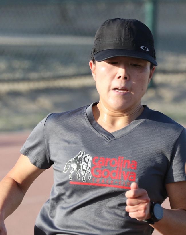 U.S. Army Maj. Jeannie Huh, orthopedic surgeon, 31st Combat Support Hospital, finishes first among all females at the Army Reserve 5k Walk or Run, April 22, at Camp Arifjan, Kuwait. The Army Reserve Engagement Cell hosted this annual event, as part of a celebratory day geared toward honoring the men and women who serve in the U.S. Army Reserves.