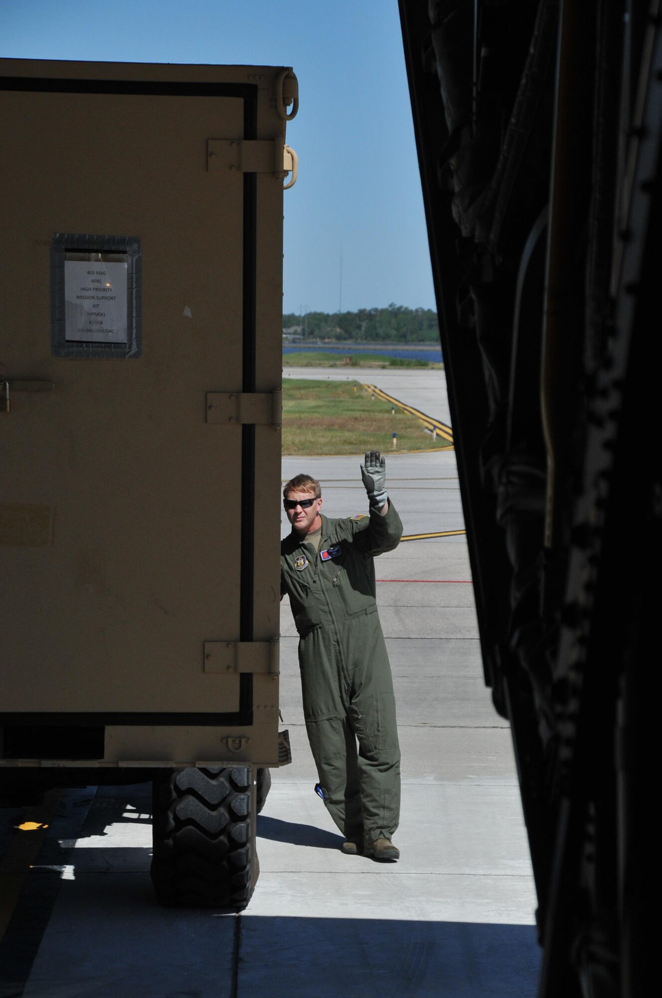 Staff Sgt. Jesse Jordan, 53rd Weather Reconnaissance loadmaster, directs a forklift operator to load cargo onto a WC-130J Super Hercules aircraft, May 1, 2017. The cargo is for the annual St. Croix "roll-out" to ensure equipment and supplies are available in the 53rd WRS's forward operating location in the event of a hurricane. (U.S. Air Force photo// Master Sgt. Jessica Kendziorek)