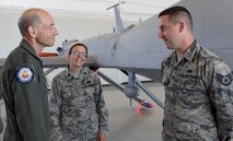 Gen. Mike Holmes, commander of Air Combat Command, speaks to Staff Sgt. Joseph, 432nd Aircraft Maintenance Squadron during his first visit to Creech Air Force Base, Nev., May 1, 2017. Holmes discussed his dedication to providing Airmen and their families with the tools necessary to continue to serve in today’s Air Force. (U.S. Air Force photo by Airman 1st Class James Thompson)
