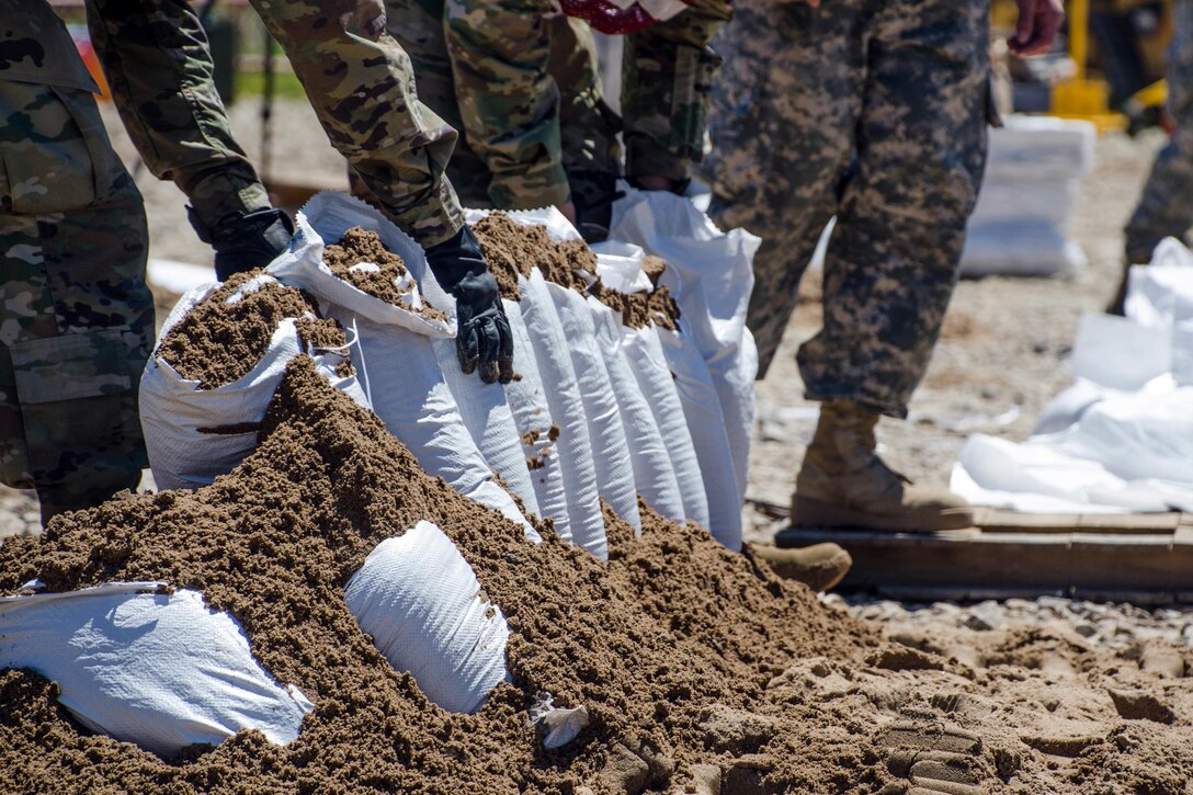 Missouri National Guardsmen fill sandbags in Poplar Bluff, Mo., May 2, 2017.  Air National Guard photo by Staff Sgt. Colton Elliott