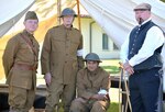 (From left) Lt. Col. Mike Williams, U.S. Army Medical Command Headquarters assistant deputy chief of staff for facilities; retired Sgt. Maj. Dave Windsor; Karl Boller and Scott Woodard, historian at the U.S. Army Medical Department, or AMEDD, Center of History and Heritage, pose in their reproduction World War I medical uniforms and clothing at a living history demonstration May 1 at the AMEDD Museum at Joint Base San Antonio-Fort Sam Houston marking the opening of a temporary exhibit, “Scientific War: Human Price,” on the role of the U.S Army Medical Department in World War I.