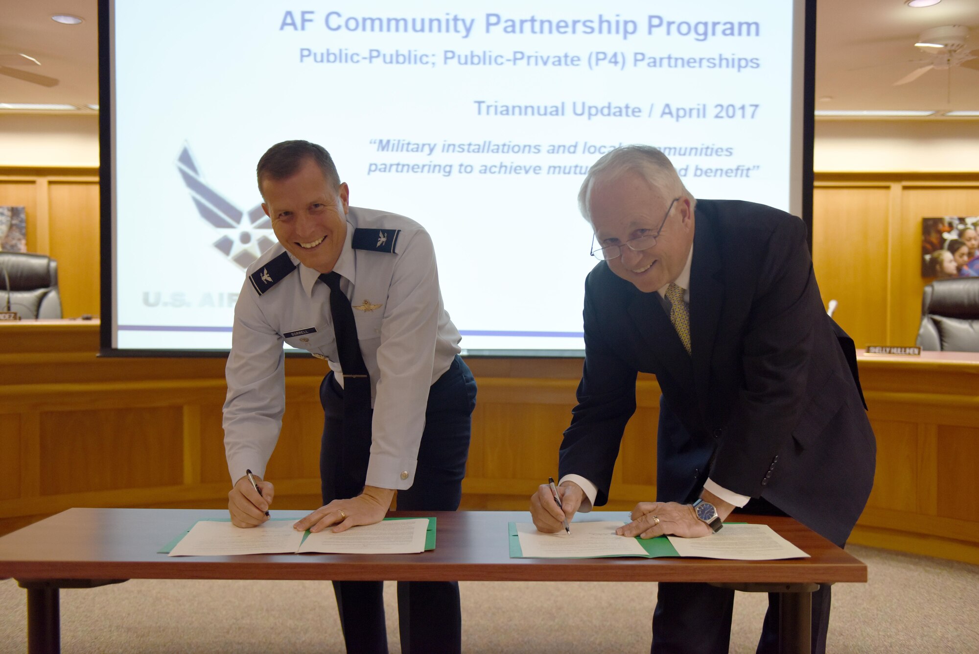 U.S. Air Force Col. Jeffrey Sorrell, 17th Training Wing Vice Commander, and Brian May, Angelo State University President, sign a Memorandum of Understanding at the San Angelo Independent School District Administration Building, Texas, April 27, 2017. The MOU allows Airmen to transfer their Air University college credits toward a criminal justice bachelor’s degree at ASU. (U.S. Air Force photo by Airman 1st Class Chase Sousa/Released)