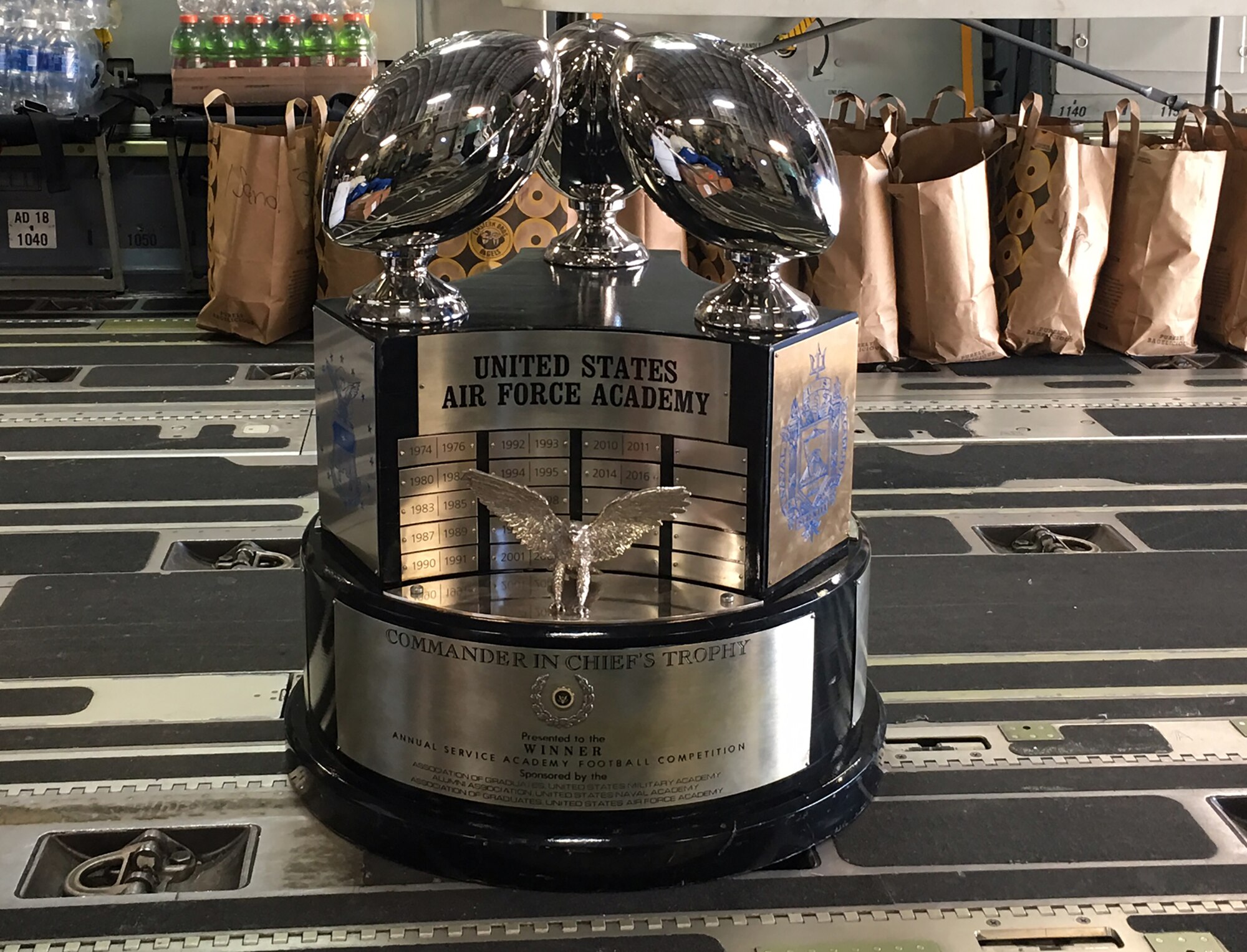 The Commander-in-Chief’s Trophy sits in the cargo area of a 445th Airlift Wing C-17 Globemaster III in Colorado Springs, Colorado May 1, 2017 before being transported to Washington, D.C. The 89th Airlift Squadron flew the Air Force Academy football team from Colorado Springs, Colorado to Washington, D.C., to officially accept the Commander-in-Chief’s Trophy from President Donald Trump at the White House May 2, 2017. The trophy is awarded to the winner of the annual service academies’ football triangular series between the U.S. Military Academy, U.S. Naval Academy and U.S. Air Force Academy. It was first awarded by President Richard Nixon in 1972. (Courtesy photo)
