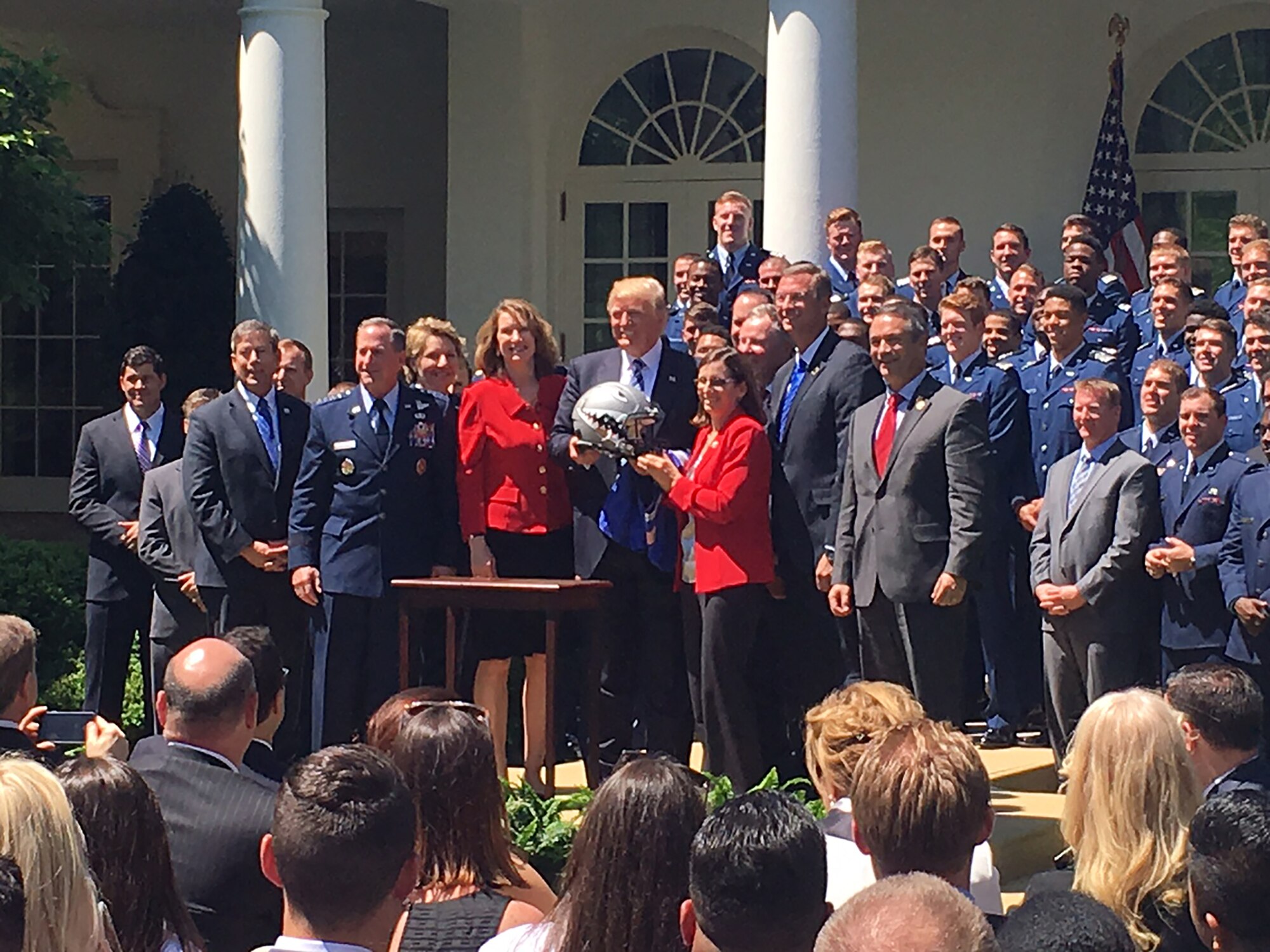 Air Force Chief of Staff Gen. David L. Goldfein, (left), and Acting Secretary of the Air Force Lisa S. Disbrow pose for a photo with President Donald Trump at the White House, May 2, 2017. Trump congratulated the U.S. Air Force Academy football team with the Commander -in -Chief's Trophy. (U.S. Air Force photo/Staff Sgt. Jannelle McRae) 