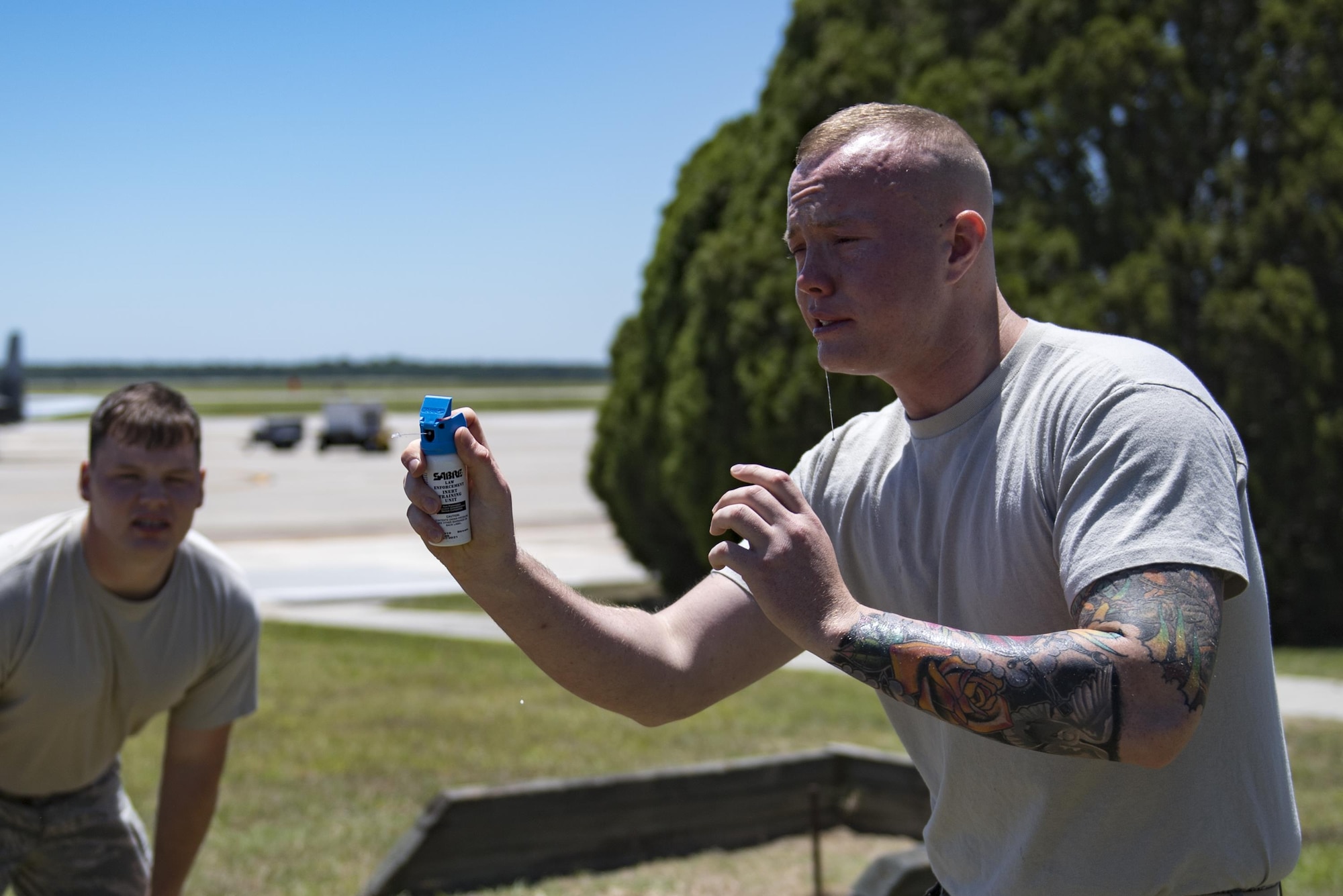 Airman 1st Class Hunter Ogle, 23d Security Forces Squadron entry controller, attempts to complete an initial confidence course after being sprayed in the face with oleoresin capsicum spray, also known as pepper spray, May 2, 2017, at Moody Air Force Base, Ga. Airmen must complete a class then pass a physical confidence course while experiencing the effects of oleoresin capsicum spray to be qualified to carry the less-than-lethal tool. (Air Force photo by Airman 1st Class Daniel Snider)