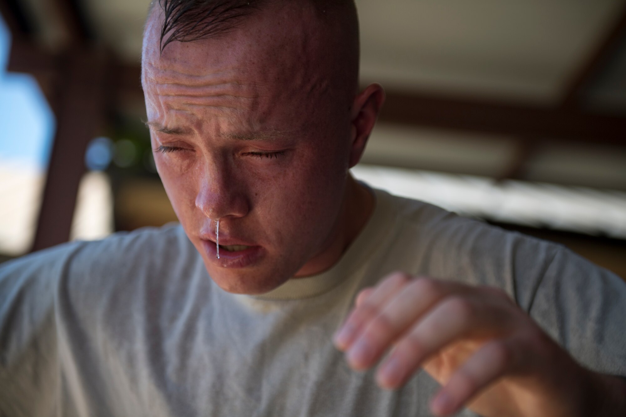 Airman 1st Class Hunter Ogle, 23d Security Forces Squadron entry controller, battles the effects of oleoresin capsicum spray, also known as pepper spray, May 2, 2017, at Moody Air Force Base, Ga. Airmen must complete a class then pass a physical confidence course while experiencing the effects of oleoresin capsicum spray to be qualified to carry the less-than-lethal tool. (Air Force photo by Airman 1st Class Daniel Snider)
