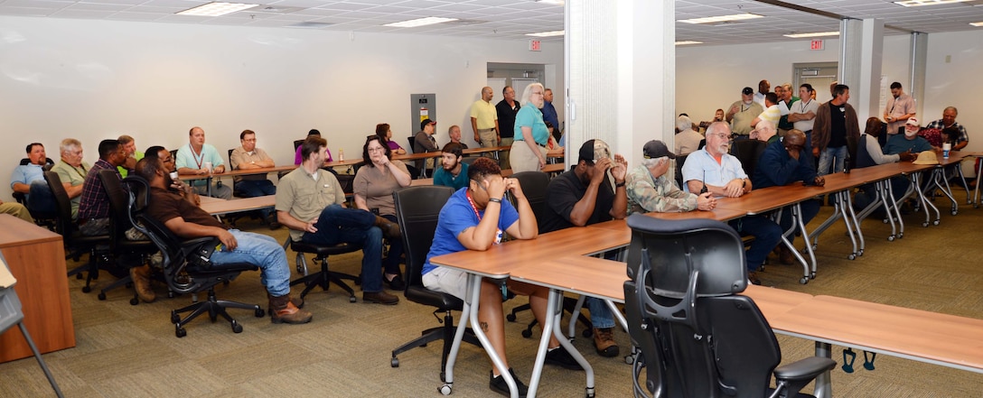Colleagues as well as family members attend an awards ceremony for Brian Cox, work leader, Heating, Ventilation and Air Conditioning, Public Works Branch, Marine Corps Logistics Base Albany, here, recently. Cox received the Marine Corps Installations EAST, 2016 Civilian of the Year commendation. Col. James C. Carroll III, commanding officer, MCLB Albany, presented the citation on behalf of Brig. Gen. Thomas Weidley, commanding general, MCIEAST, Camp Lejeune, N.C.
