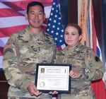 Maj. Gen. K.K. Chinn, U.S. Army South commanding general, presents Chief Warrant Officer 5 Martina Robles with her appointment and charge of orders certificate as the new Army South Senior Warrant Officer Advisor. 