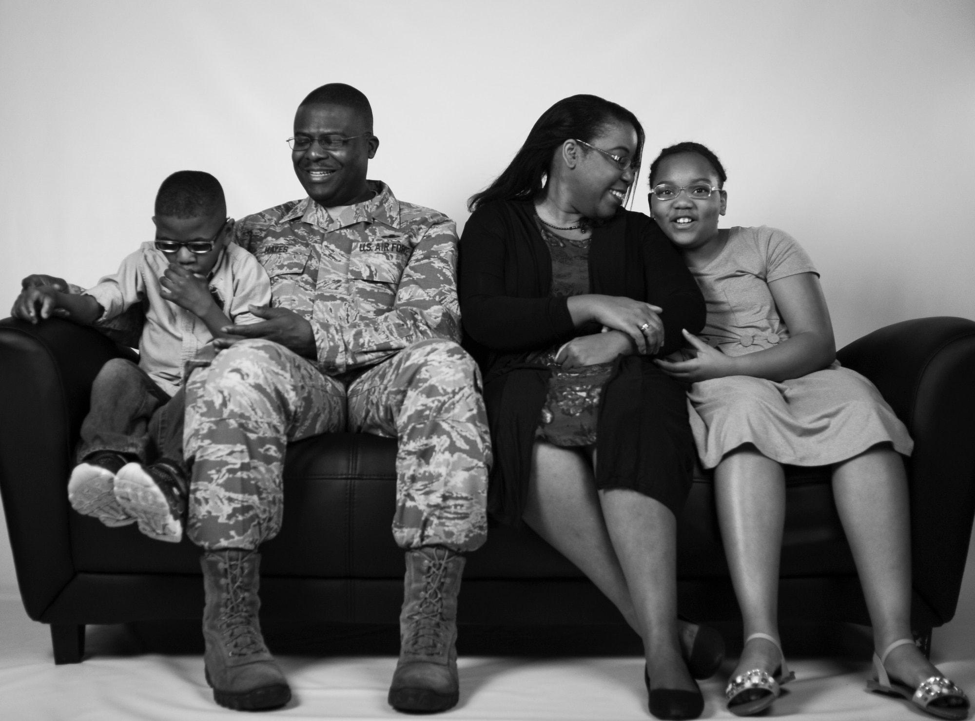 Chief Master Sgt. Henry Hayes, the Air Combat Command’s first sergeant, poses for a photo with his wife, Stephanie, and their adopted children at Joint Base Langley-Eustis, Va., March 27, 2017. Along with adopting two children, the family has also fostered 13 children. (U.S. Air Force photo/Staff Sgt. Natasha Stannard)