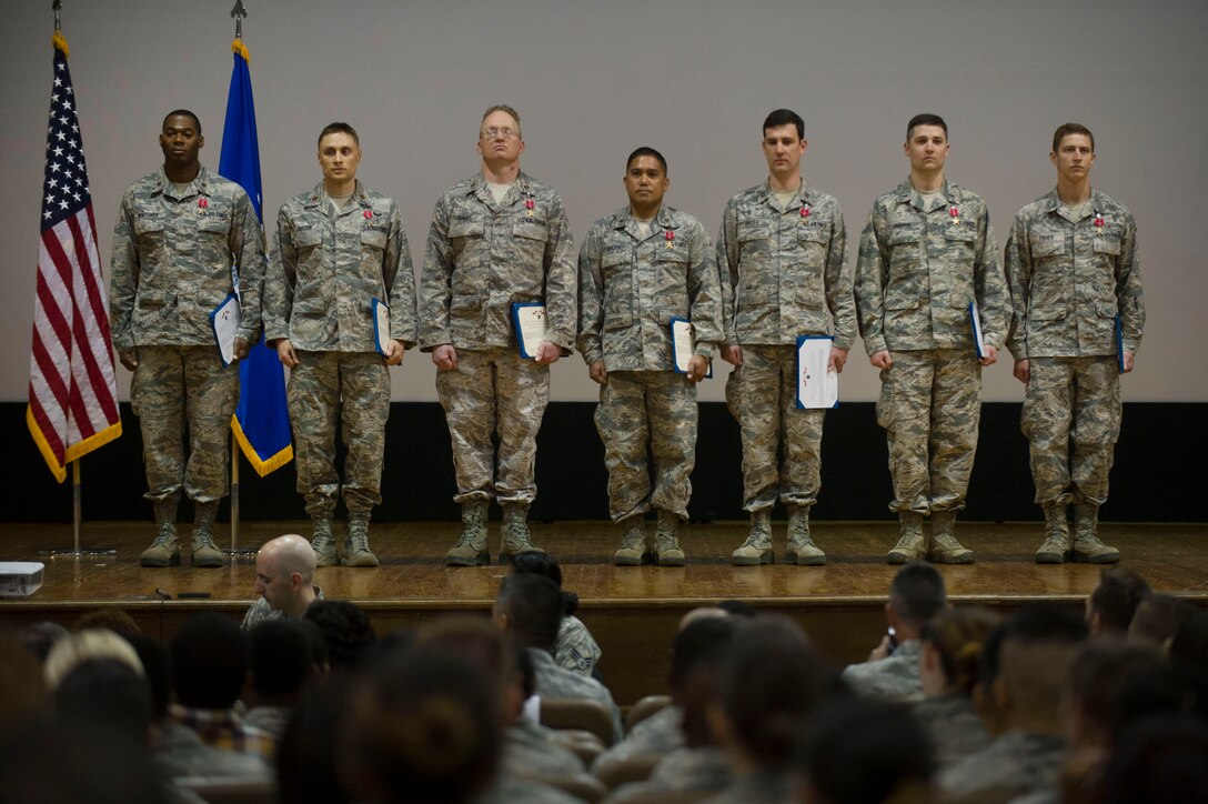 Bronze Star Medal recipients from the 779th Medical Group stand as they are recognized during a 779th Medical Group commander's call at Joint Base Andrews, Md., May 3, 2017. The individuals in the group were each presented a medal for their life saving work during a recent deployment. (Photo by Senior Master Sgt. Adrian Cadiz)(Released)
