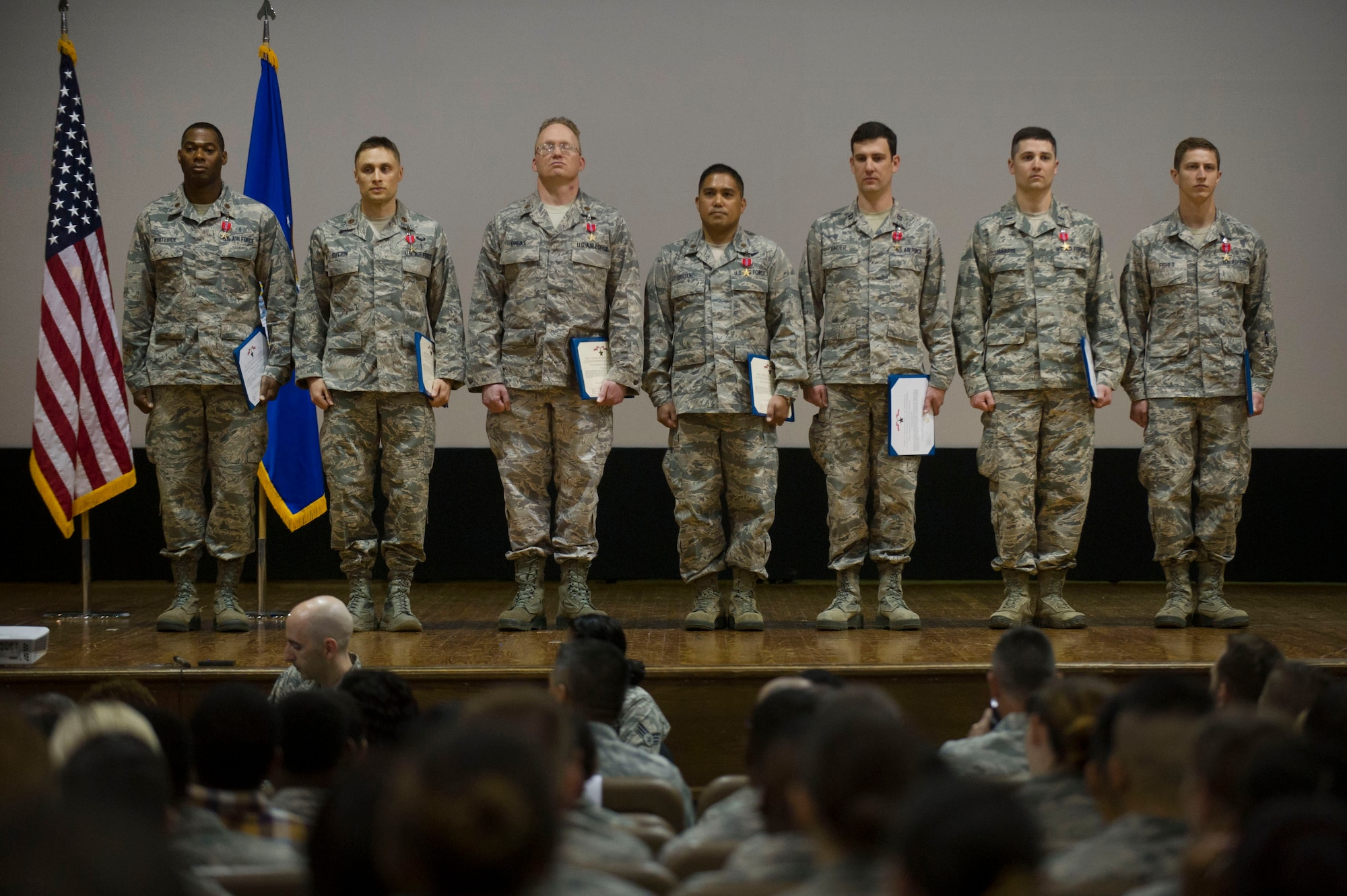Bronze Star Medal recipients from the 779th Medical Group stand as they are recognized during a 779th Medical Group commander's call at Joint Base Andrews, Md., May 3, 2017. The individuals in the group were each presented a medal for their life saving work during a recent deployment. (Photo by Senior Master Sgt. Adrian Cadiz)(Released)