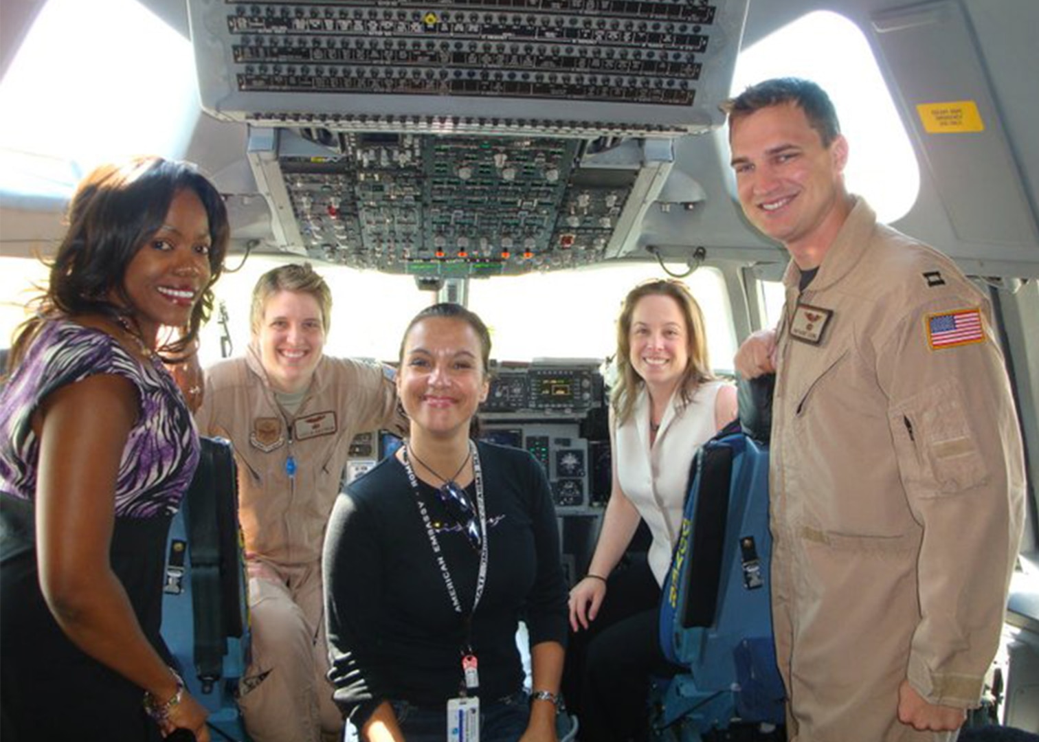 DAS members in a military aircraft cockpit while on assignment. 