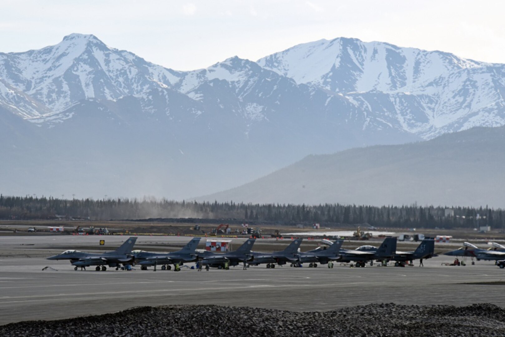 Military personnel perform safety inspections on dozens of aircraft on the Joint Base Elmendorf-Richardson, Alaska, flightline ramp before takeoff during Exercise Northern Edge 2017. Northern Edge is Alaska's largest and premier joint training exercise designed to practice operations, techniques and procedures as well as enhance interoperability among the services. Thousands of participants from all the services-Airmen, Soldiers, Sailors, Marines and Coast Guard personnel from active duty, Reserve and National Guard units-are involved.