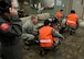 A group of medical technicians from the 97th Medical Operations Squadron lift a stretcher as part of an exercise, May 3, 2017, at Altus Air Force Base, Oklahoma. Nurses and technicians handle a variety of care for patients and are constantly trained to provide the best support. (U.S. Air Force Photo by Airman 1st Class Jackson N. Haddon/Released).