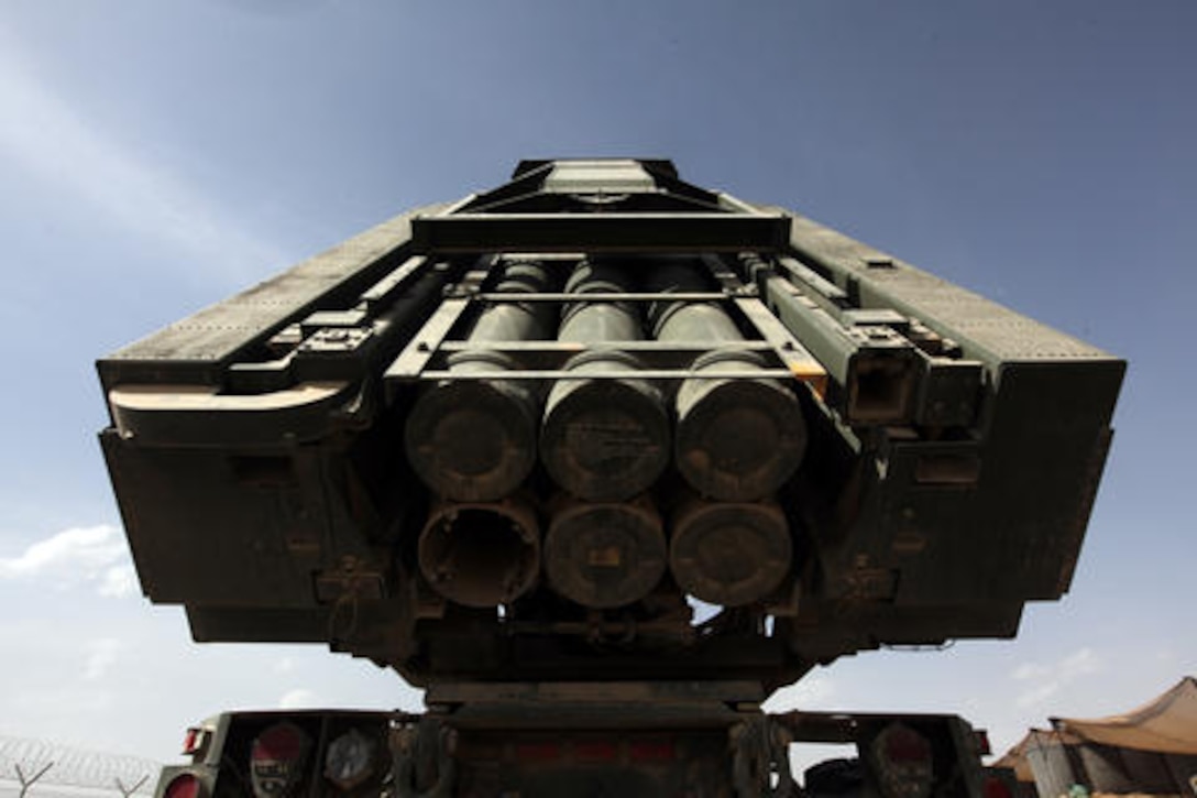 Marines raise the firing tubes of a high-mobility artillery rocket system at Camp Delaram II, Afghanistan, April 13, 2011. The Marines are with 3rd Platoon, Rocket Battery Kilo, 2nd Battalion, 14th Marine Regiment, 4th Marine Division. The HIMARS has been retrograded to fire MGM-140 Army tactical missile system missiles, ATACMS, providing extended range and a larger payload. Marine Corps photo by Lance Cpl. Justin C. Davis