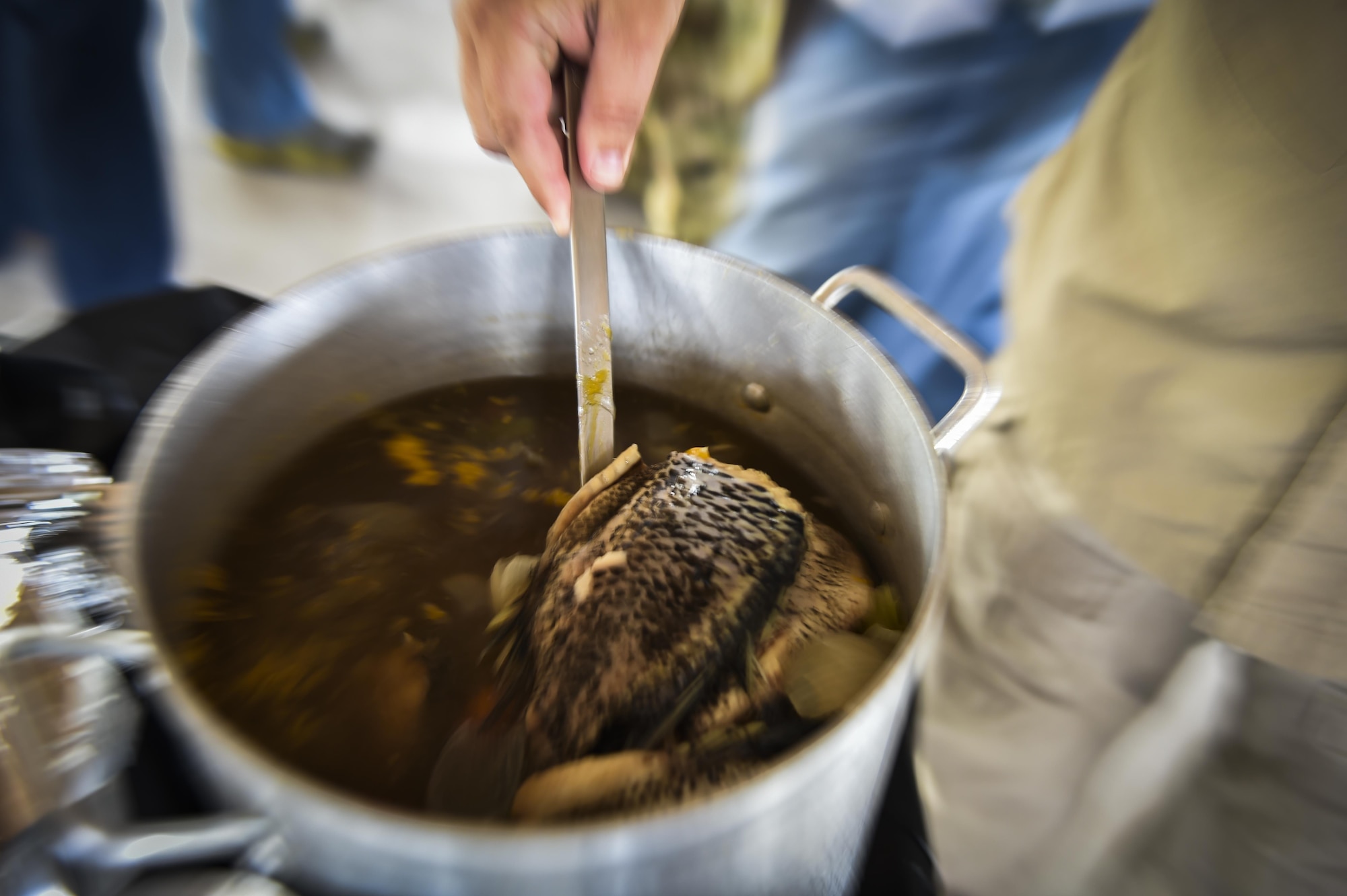 Fish head soup is served to 6th Special Operations Squadron combat aviation advisor students during Operation Raven Claw at Duke Field, Fla., April 26, 2017. Students joined their partners in a meal that is considered a luxury in “Palmetto Land” culture to strengthen relationships. (U.S. Air Force photo by Airman 1st Class Joseph Pick)